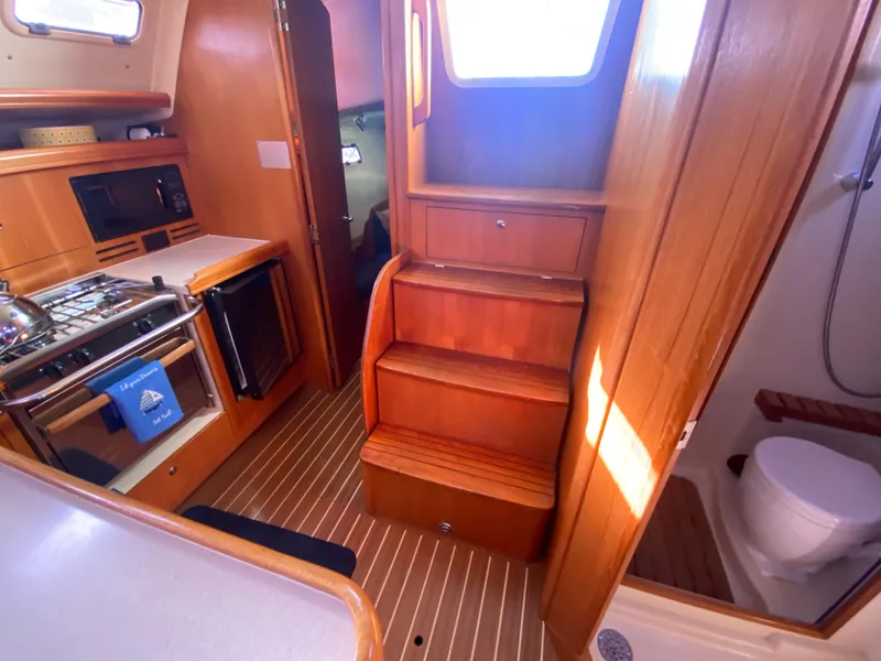 Slide: The Image of Interior of a 2006 Hunter 38 yacht with kitchen and bathroom. - 35