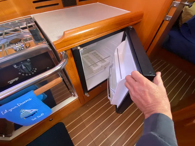 Slide: The Image of Galley area of a 2006 Hunter 38 yacht with open fridge. - 38