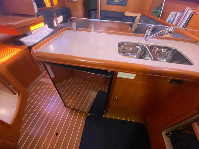 Slide: The Image of Interior of a 2006 Hunter 38 yacht featuring a modern kitchen. - 41