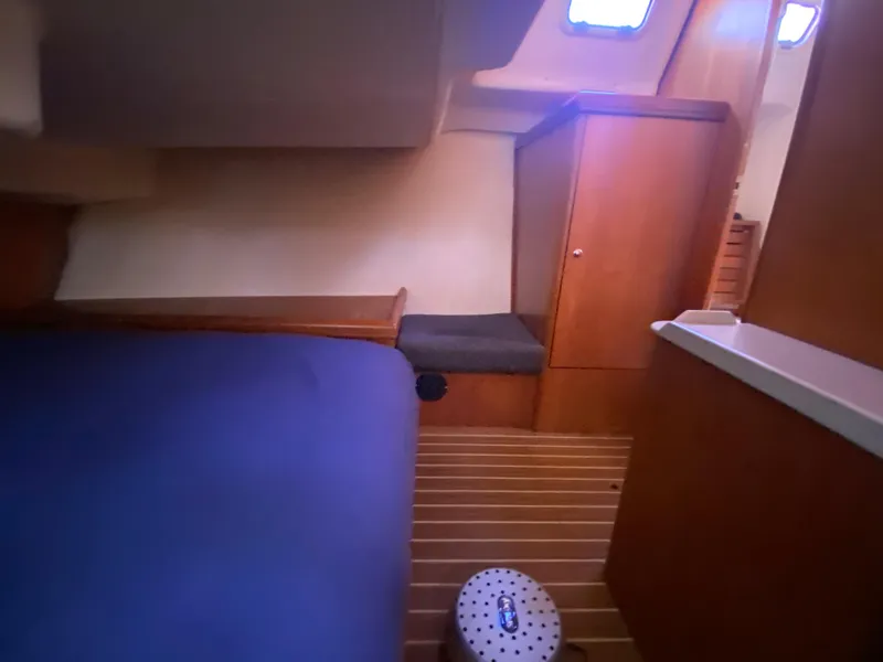 Slide: The Image of Interior of a 2006 Hunter 38 yacht with wooden furnishings. - 45