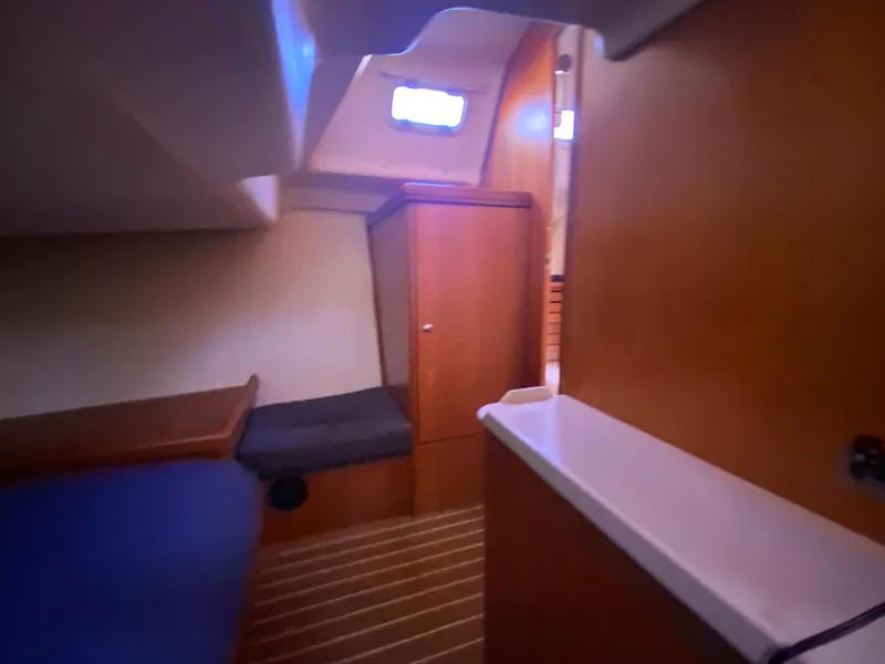 Slide: The Image of Interior of 2006 Hunter 38 sailboat cabin with wooden finish. - 47
