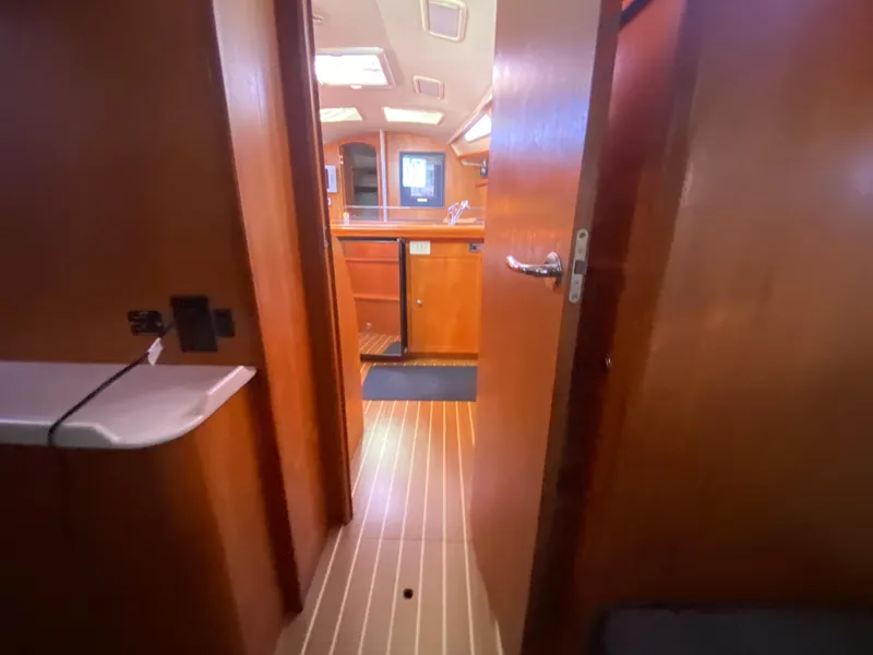 Slide: The Image of Interior of a 2006 Hunter 38 yacht with wooden finish. - 48