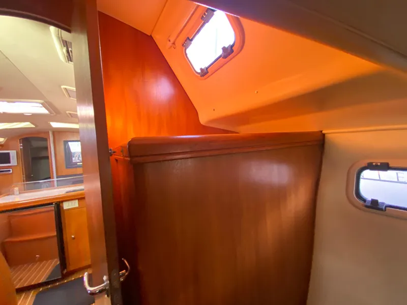 Slide: The Image of Interior of a 2006 Hunter 38 yacht with wooden furnishings. - 49