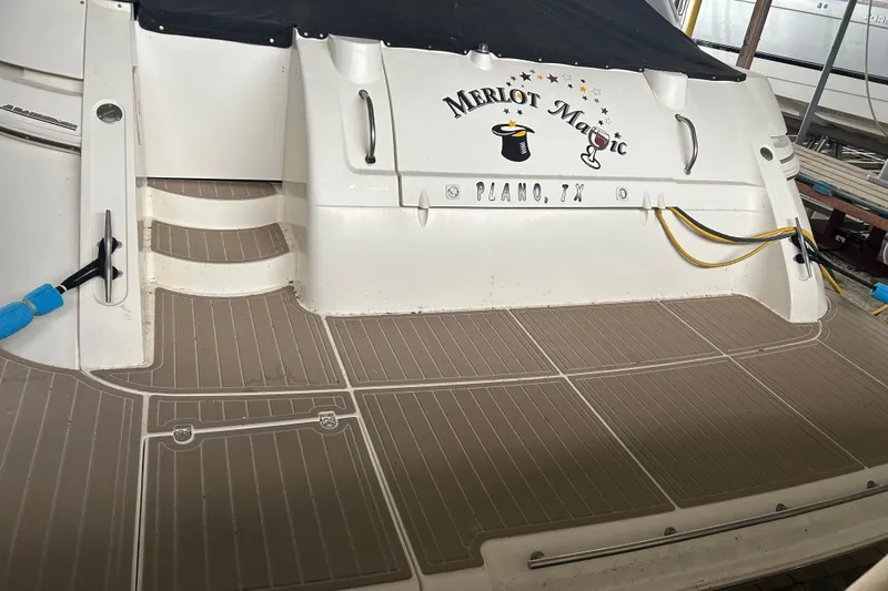 Slide: The Image of 1998 Cruisers Yachts 4270 Express boat deck with "Merlot Magic" name, Plano, TX. - 2
