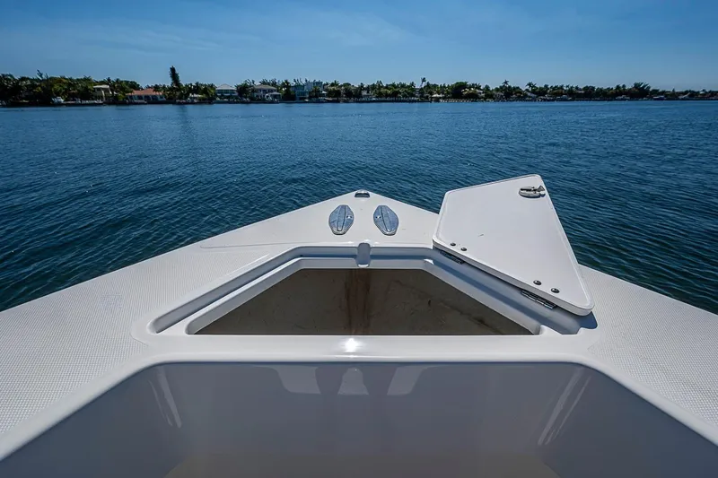 Slide: The Image of Bow view of 2017 Venture 39 Open boat on calm water. - 26