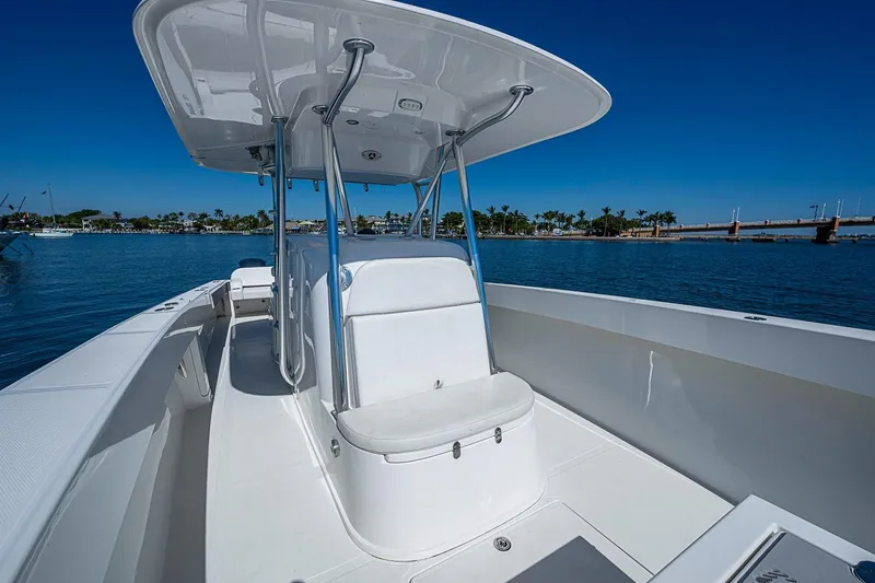 Slide: The Image of 2017 Venture 39 Open boat on calm water, featuring sleek design and spacious deck. - 28