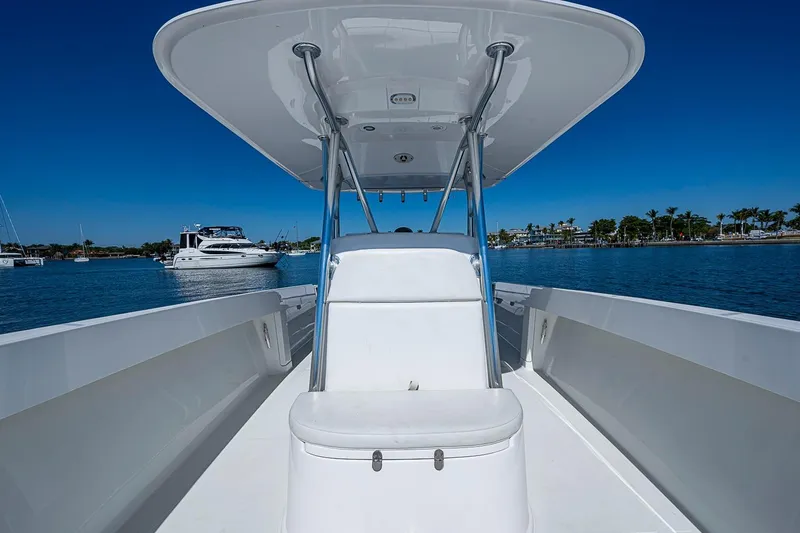 Slide: The Image of 2017 Venture 39 Open boat on calm water, clear blue sky background. - 29