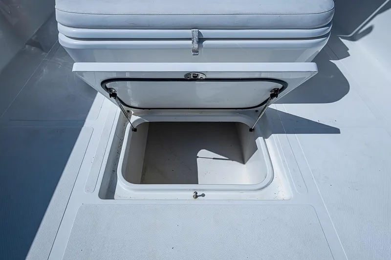 Slide: The Image of Open storage compartment on 2017 Venture 39 Open boat deck. - 36