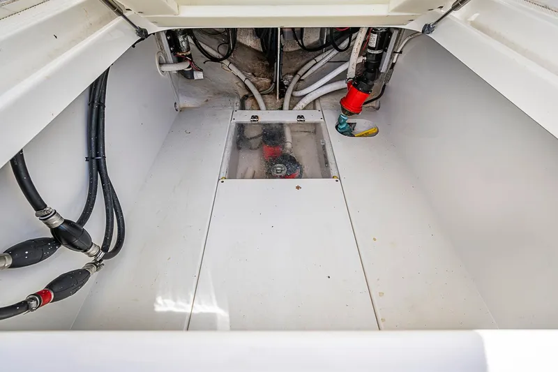 Slide: The Image of Engine compartment of a 2017 Venture 39 Open boat, showcasing clean wiring and plumbing. - 37