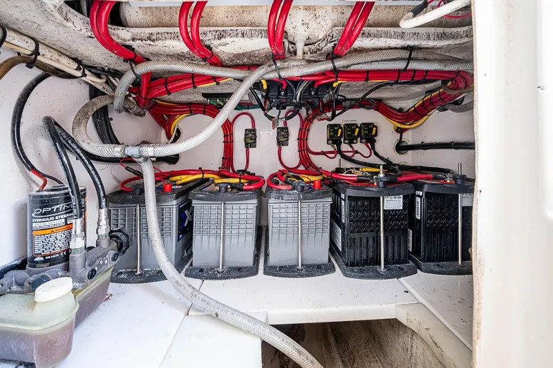 Slide: The Image of Electrical system of a 2017 Venture 39 Open boat with batteries and wiring. - 44