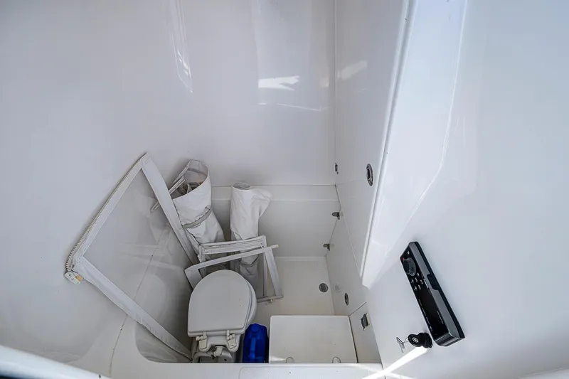 Slide: The Image of 2017 Venture 39 Open boat interior with toilet and storage items. - 45