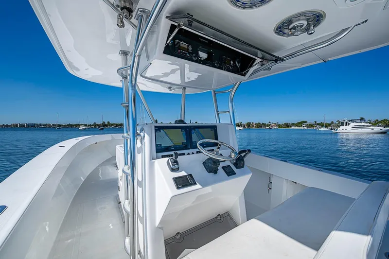 Slide: The Image of 2017 Venture 39 Open boat helm with navigation system on calm water. - 47