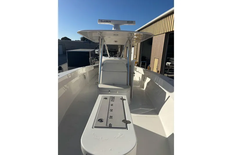Slide: The Image of 2017 Venture 39 Open boat with Garmin equipment, docked near a warehouse. - 9