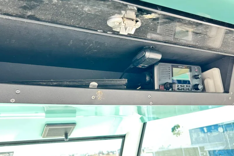 Slide: The Image of 2023 Blackfin 332 CC boat dashboard with Garmin radio equipment. - 16