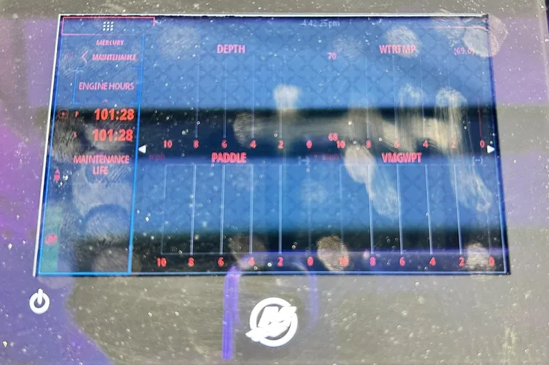 Slide: The Image of Display screen of a 2023 Blackfin 332 CC boat showing engine hours and maintenance data. - 17
