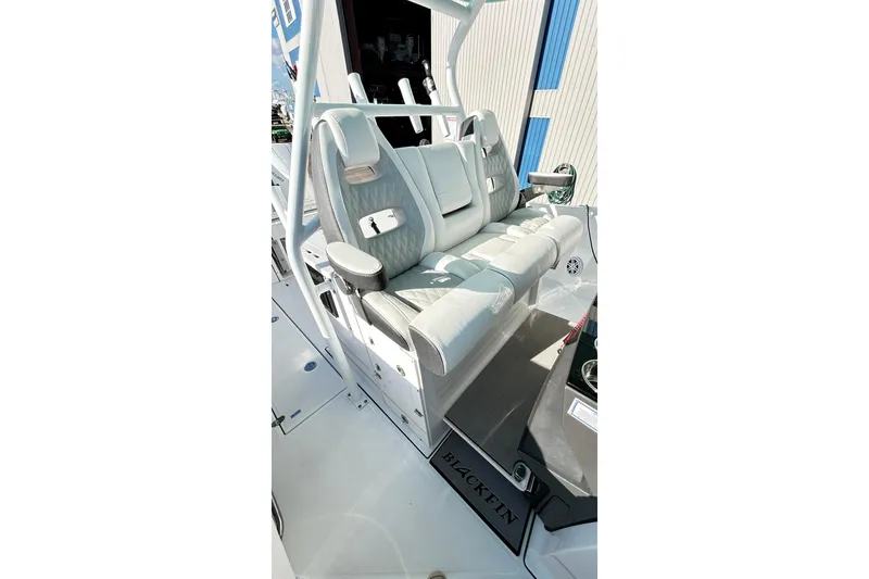 Slide: The Image of 2023 Blackfin 332 CC boat interior with luxurious seating and modern design. - 18