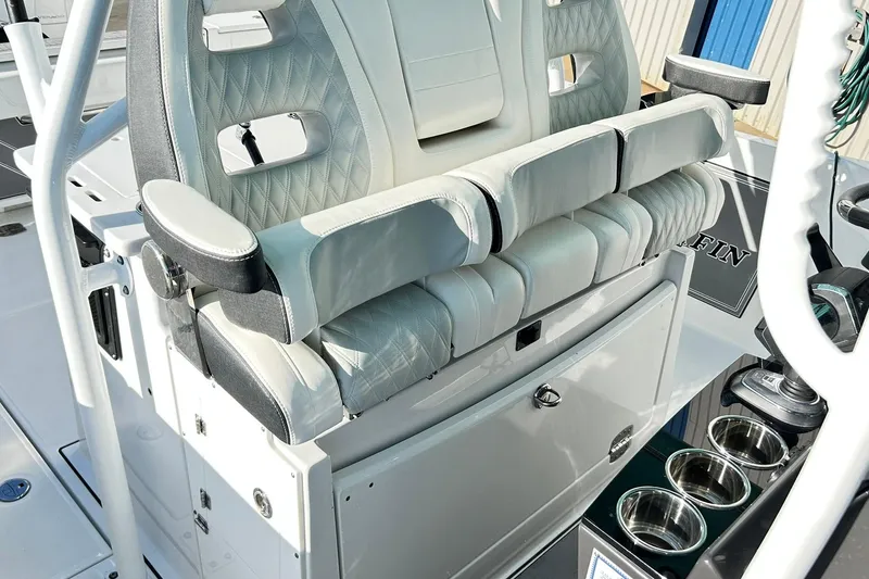 Slide: The Image of 2023 Blackfin 332 CC boat seating with armrests and cup holders. - 19