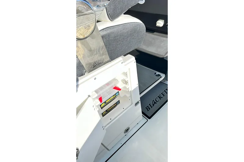 Slide: The Image of 2023 Blackfin 332 CC boat interior with storage compartment and seating. - 22