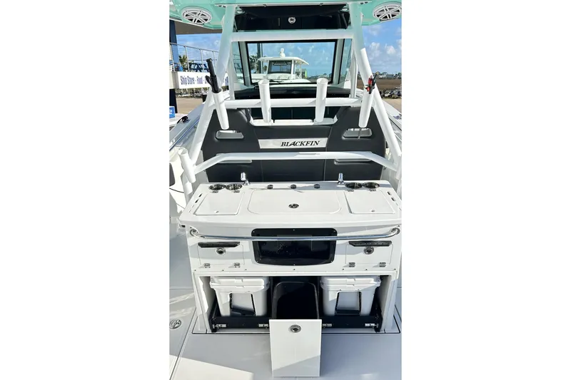 Slide: The Image of 2023 Blackfin 332 CC boat interior with fishing station and storage compartments. - 24