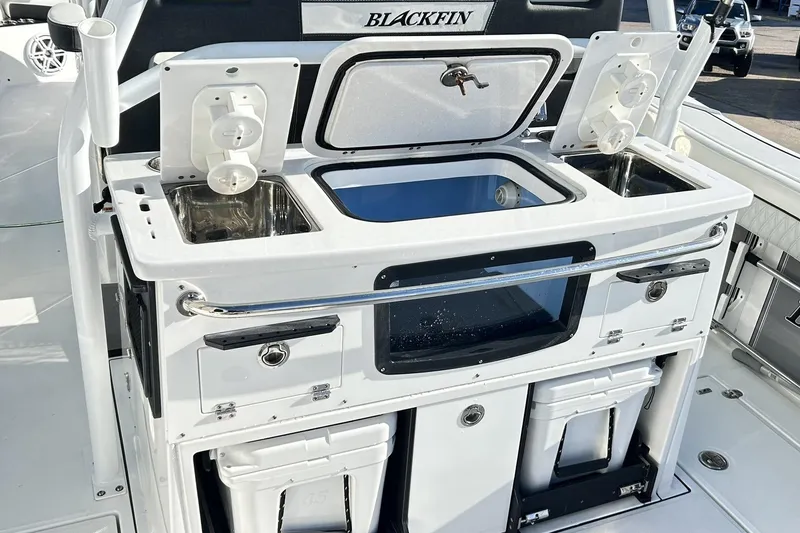 Slide: The Image of 2023 Blackfin 332 CC boat with integrated sink and storage compartments. - 26