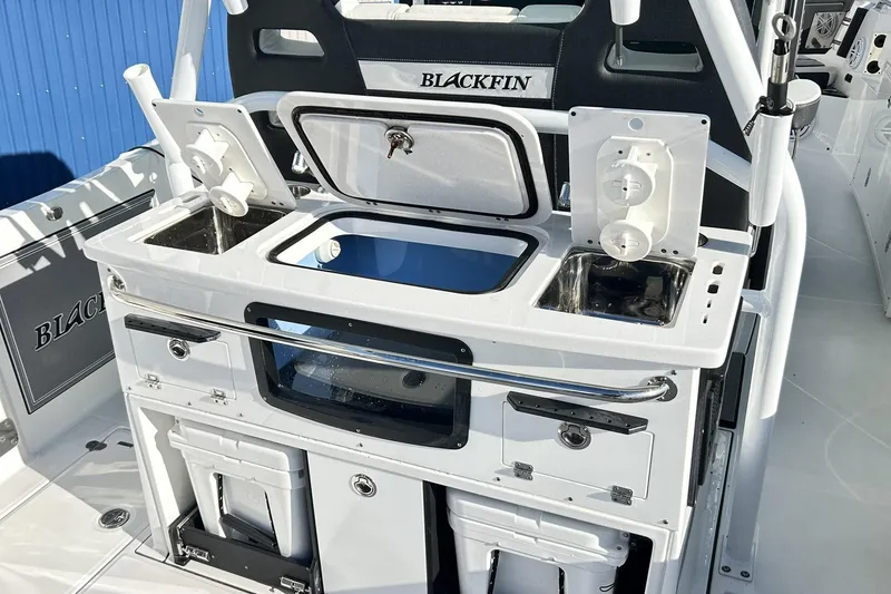 Slide: The Image of 2023 Blackfin 332 CC boat interior with fishing station and storage compartments. - 27