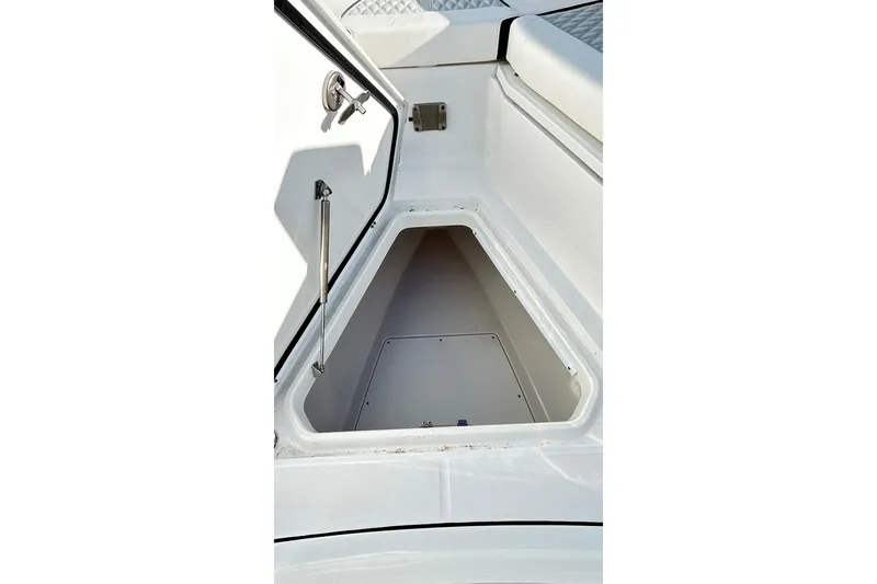 Slide: The Image of 2023 Blackfin 332 CC boat storage compartment with open hatch. - 31