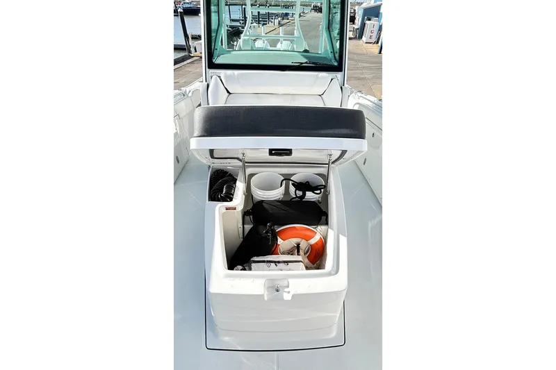 Slide: The Image of 2023 Blackfin 332 CC boat storage compartment with safety gear and equipment. - 40
