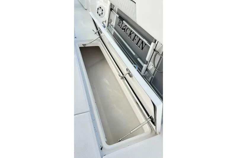 Slide: The Image of 2023 Blackfin 332 CC boat storage compartment with hydraulic supports. - 48
