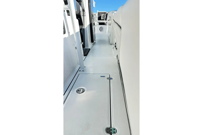 Slide: The Image of 2023 Blackfin 332 CC boat interior with sleek white deck and modern design. - 49