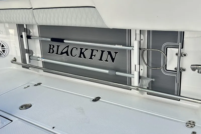 Slide: The Image of 2023 Blackfin 332 CC boat interior with rod holders and logo. - 50