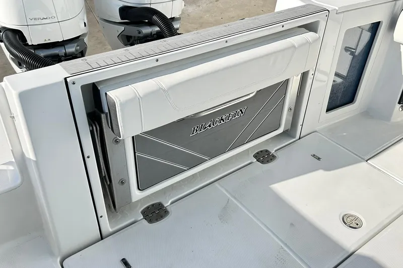 Slide: The Image of 2023 Blackfin 332 CC boat with foldable seat and dual Verado engines. - 52