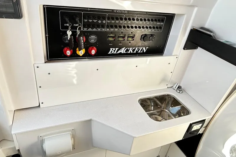Slide: The Image of 2023 Blackfin 332 CC control panel and sink area, featuring modern design and functionality. - 66