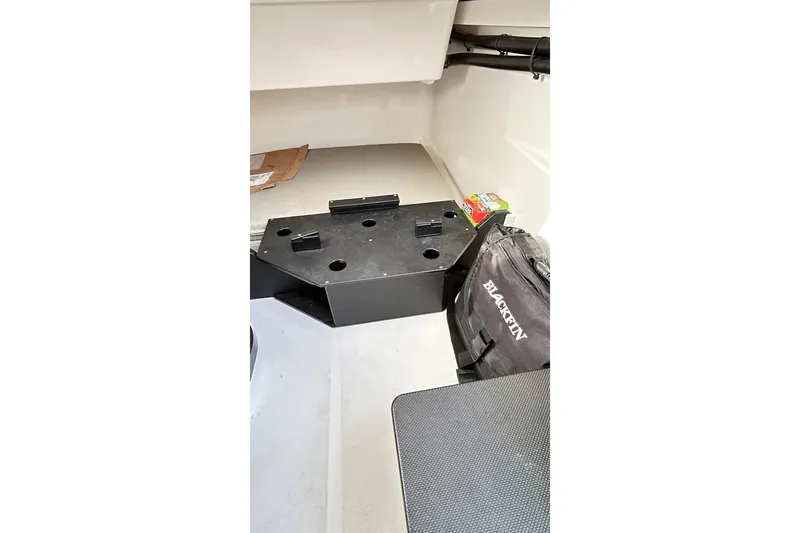 Slide: The Image of 2023 Blackfin 332 CC interior cabin with storage and Blackfin bag. - 68