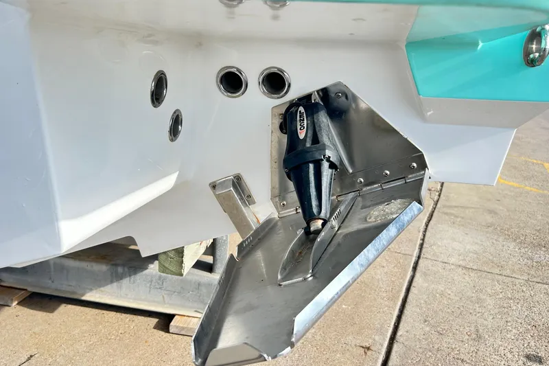Slide: The Image of 2023 Blackfin 332 CC boat hull with trim tab and drain holes. - 79