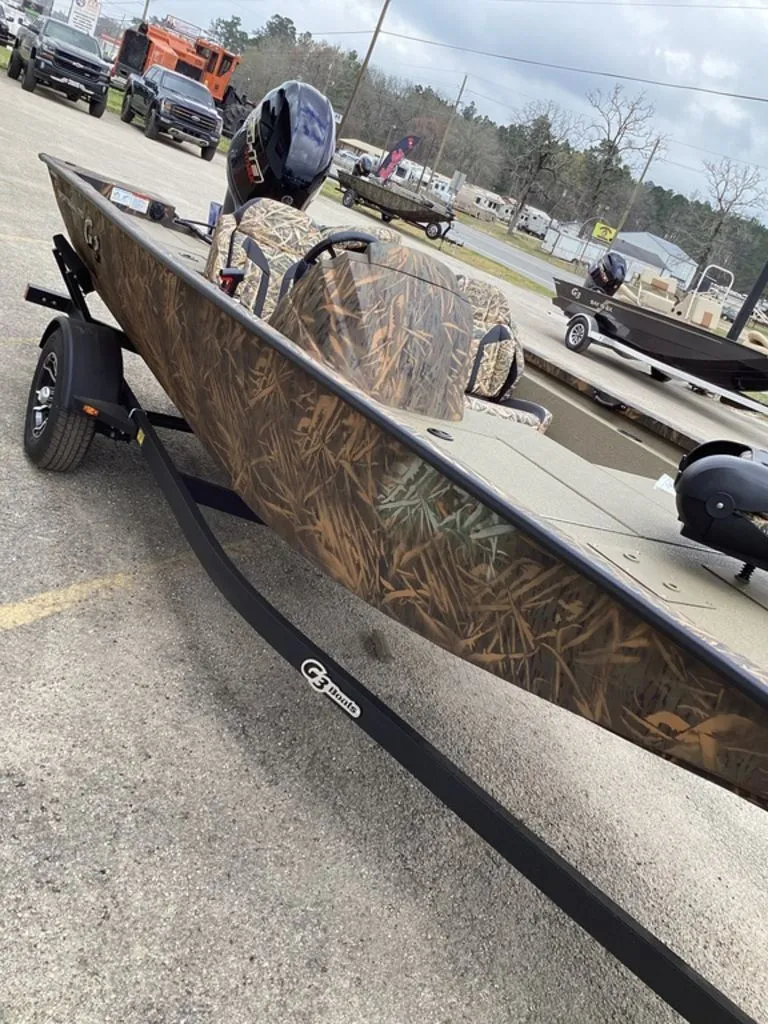Slide: The Image of 2026 G3 Sportsman 1710 boat with camouflage pattern on trailer. - 11