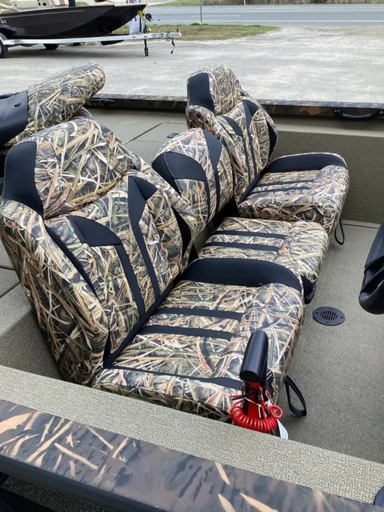 Slide: The Image of 2026 G3 Sportsman 1710 boat with camouflage-patterned seats. - 15