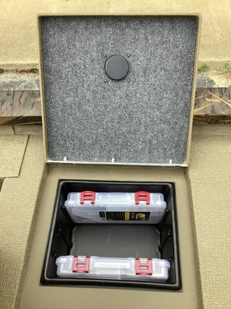 Slide: The Image of G3 Sportsman 1710 boat, open storage compartment with boxes, 2026 model. - 22