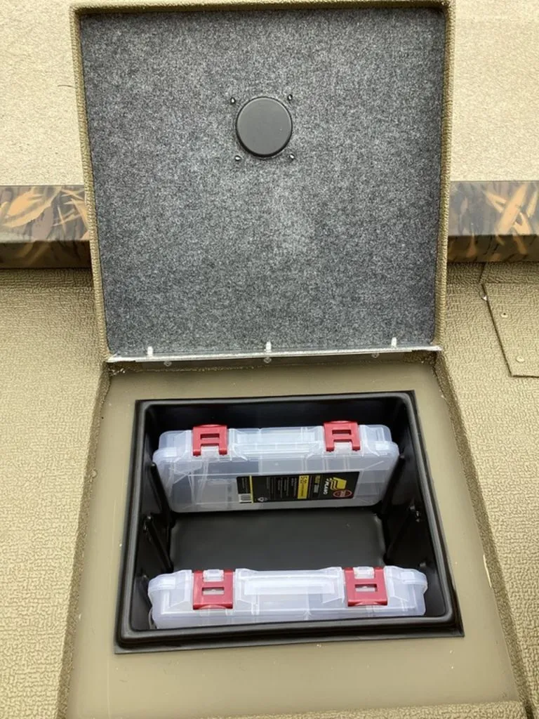 Slide: The Image of G3 Sportsman 1710 storage compartment with two plastic boxes, 2026 model. - 23
