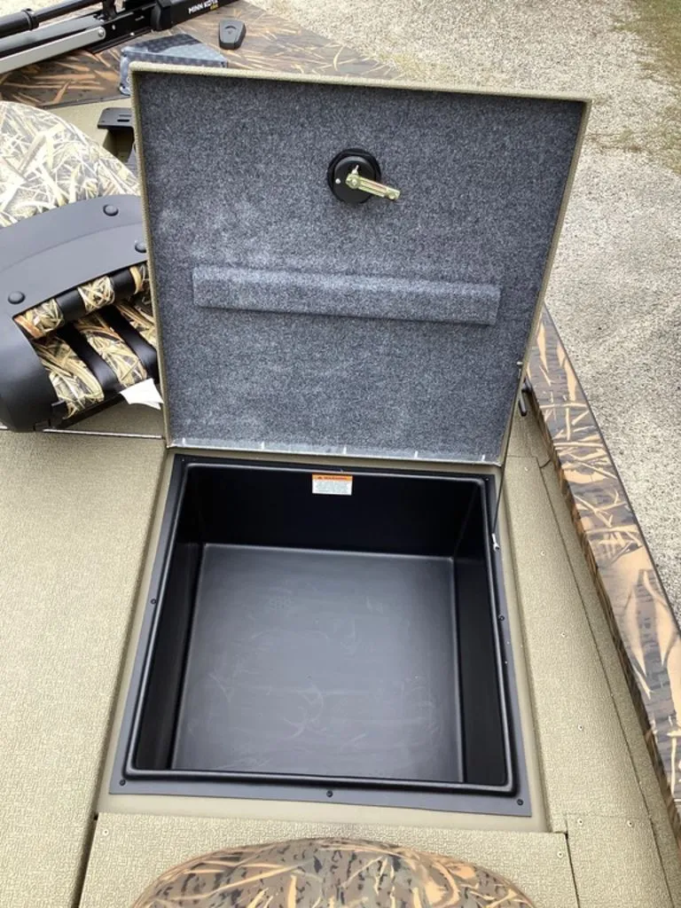 Slide: The Image of Open storage compartment in G3 Sportsman 1710 boat, model 2026. - 36