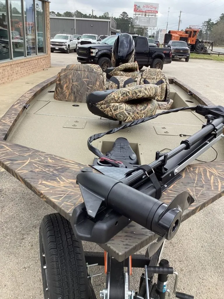 Slide: The Image of 2026 G3 Sportsman 1710 boat with camouflage pattern and trailer. - 8