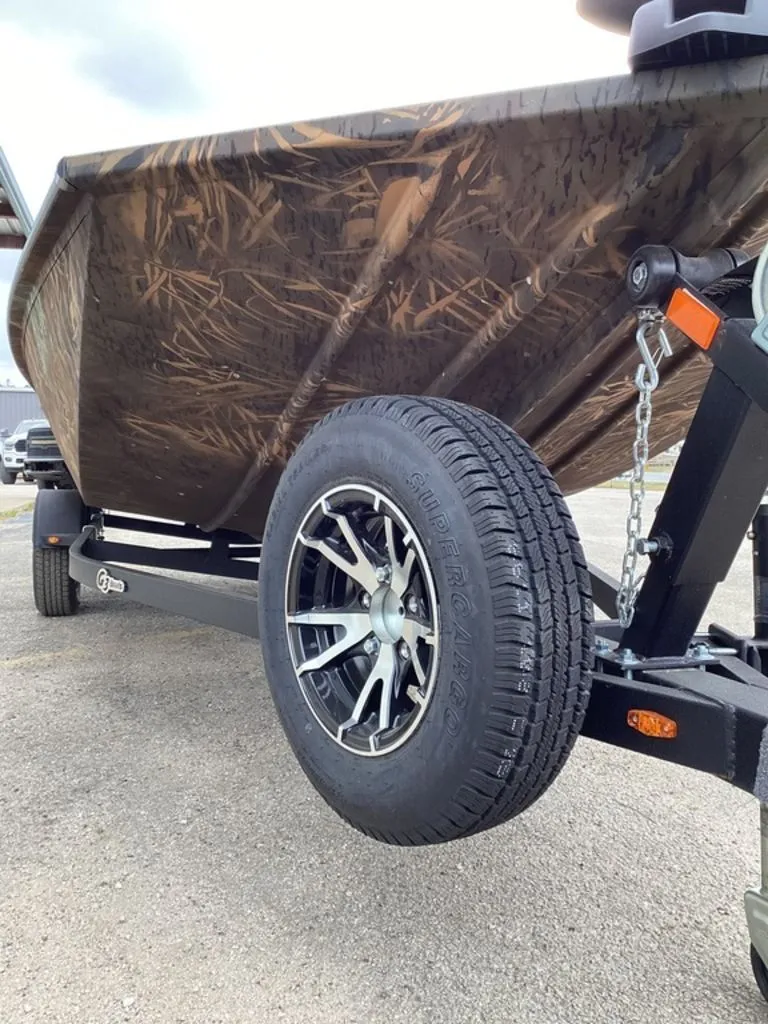 Slide: The Image of 2026 G3 Sportsman 1710 boat on trailer with camouflage pattern. - 9
