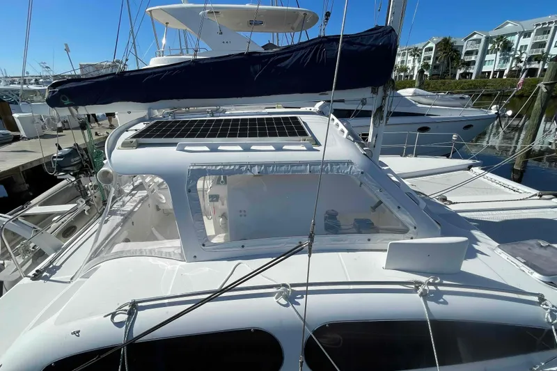 Slide: The Image of 1998 Maine Cat Catamaran deck detail with hatch and rope. - 21
