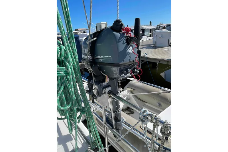 Slide: The Image of 1998 Maine Cat Catamaran cockpit with steering wheel and white chair. - 25