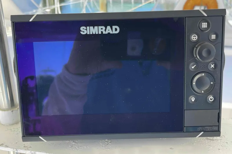 Slide: The Image of Interior view of a 1998 Maine Cat Catamaran cockpit with navigation equipment. - 32