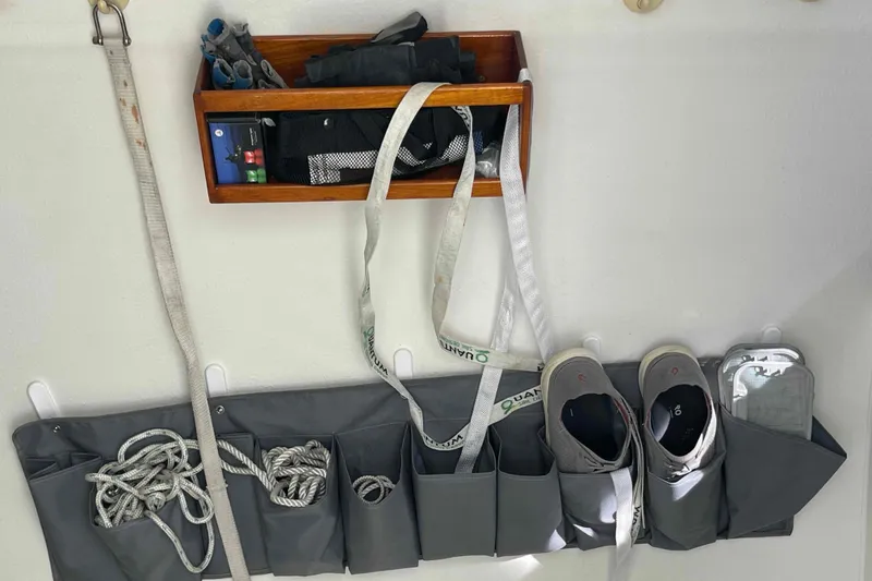 Slide: The Image of Spacious 1998 Maine Cat Catamaran cockpit with steering wheel and seating under clear blue sky. - 43