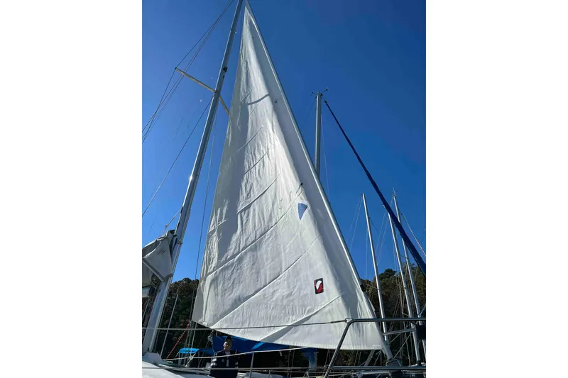 Slide: The Image of Sticker on a 1998 Maine Cat Catamaran sail, featuring Quantum logo and zigzag stitching. - 74