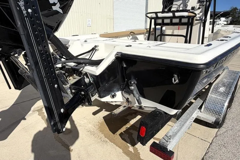 Slide: The Image of 2016 Key West 230 Bay Reef boat on trailer, rear view, black and white design. - 12