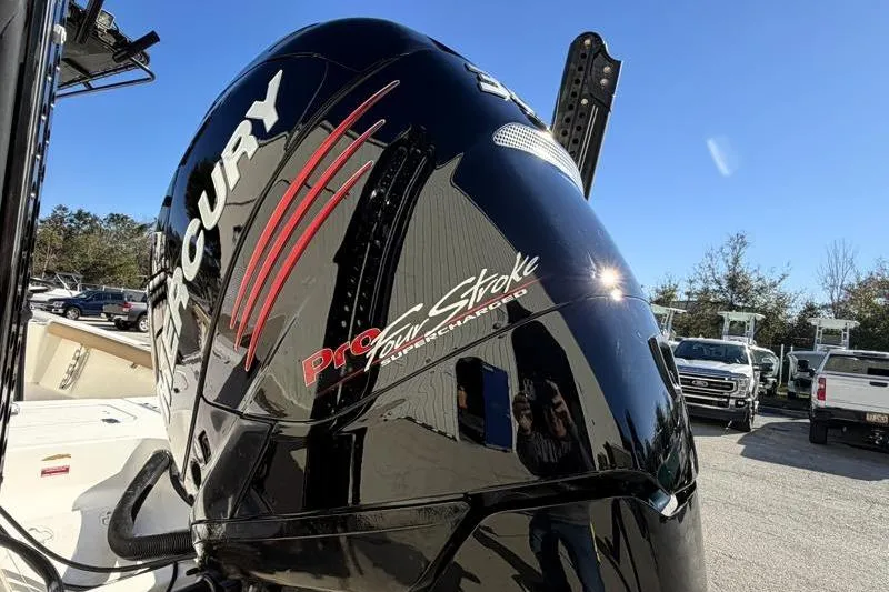 Slide: The Image of 2016 Key West 230 Bay Reef with Mercury Pro FourStroke engine in a sunny outdoor setting. - 13