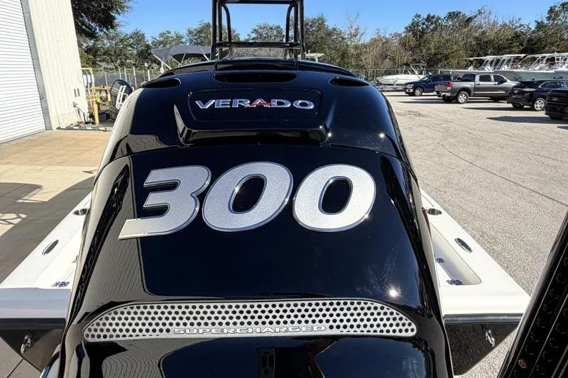 Slide: The Image of 2016 Key West 230 Bay Reef with 300 HP Verado engine, supercharged, in a parking lot. - 15