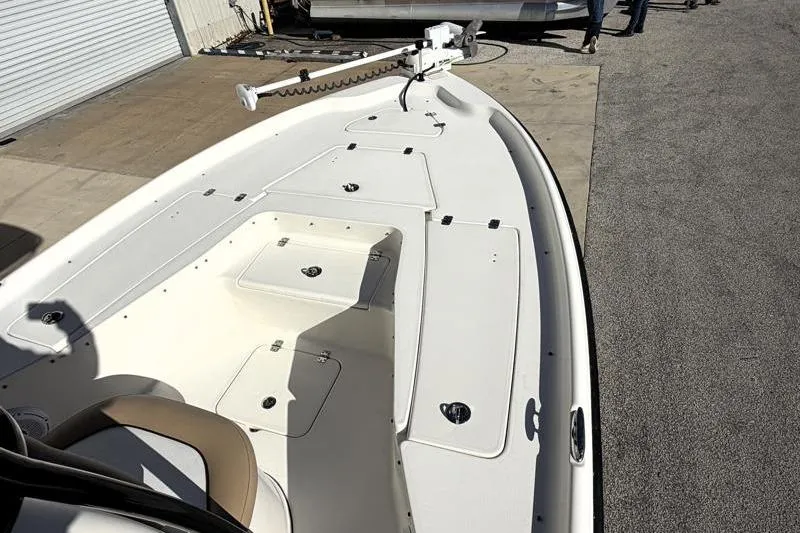 Slide: The Image of 2016 Key West 230 Bay Reef boat deck with storage compartments and trolling motor. - 20